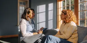 Clinician discussing anxiety and addiction treatment with a patient
