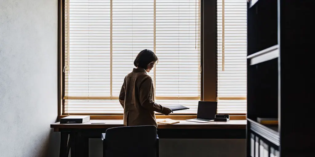 Professional preparing notes while learning how to tell your employer you are going to rehab