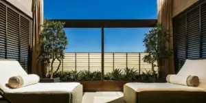 Peaceful luxury rehab facility interior with comfortable seating and warm natural light