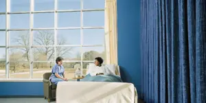 Patient discussing addiction recovery options with a clinician
